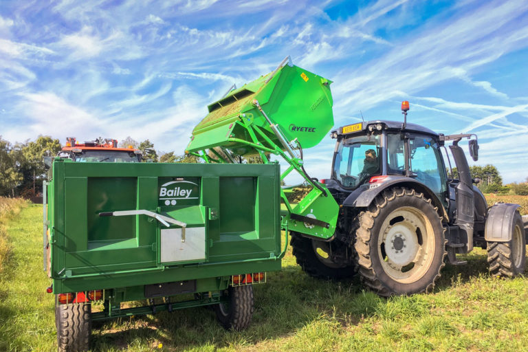 TB8-11 trailer being loaded by tractor