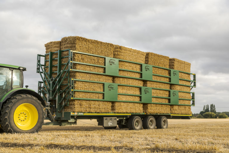 fully loaded bale trailer with hydraulic clamps