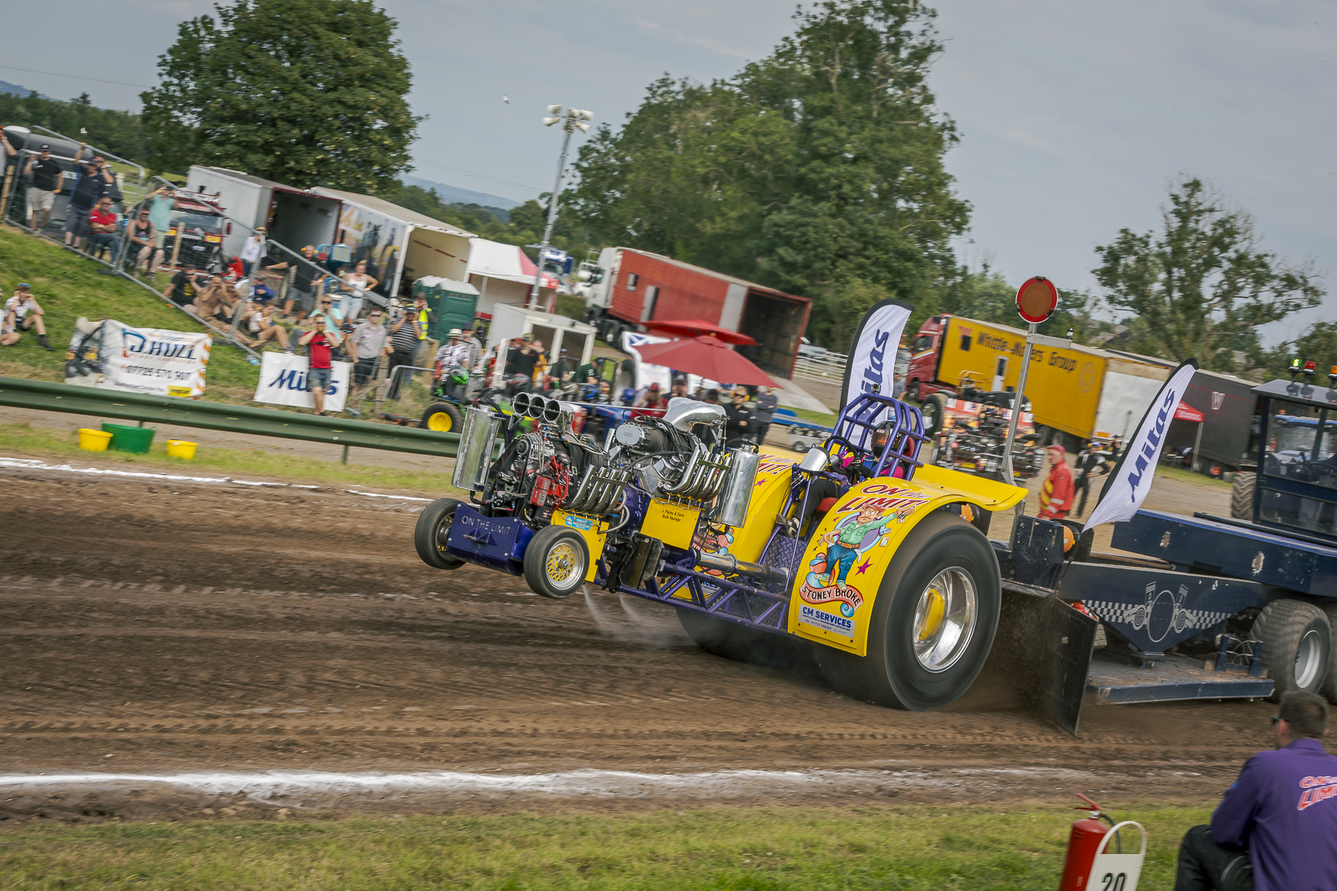 The On The Limit team competing in a tractor pulling race